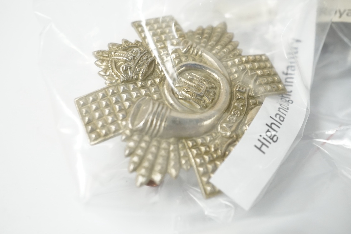 Eighteen Scottish and the Borders cap badges and Glengarry badges, including; Royal Scot Fusiliers, 96th Regiment of Foot, the Black Watch, Cameron Highlanders, Argyle and Sutherland Highlanders, Highland Light Infantry